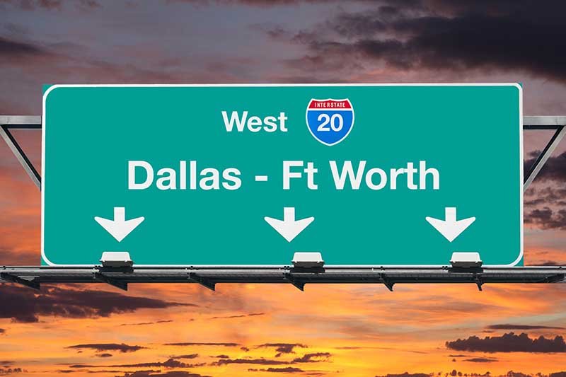 Dallas Ft Worth Interstate 20 West Highway Sign with Sunrise Sky